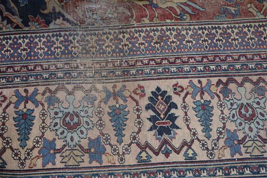 A Persian blue ground carpet, 17ft 11in by 10ft 1in.